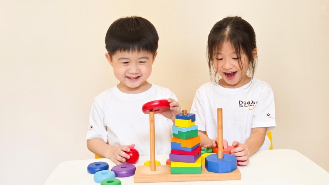 Two preschool children playing a wooden stacking game